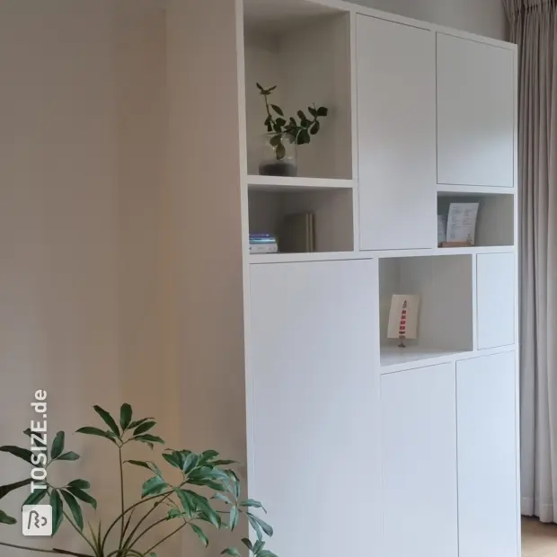 White cabinet with doors and open compartments