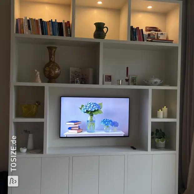 White cupboard wall with open compartments and doors
