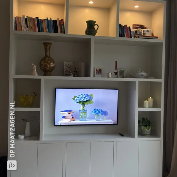 White cupboard wall with open compartments and doors