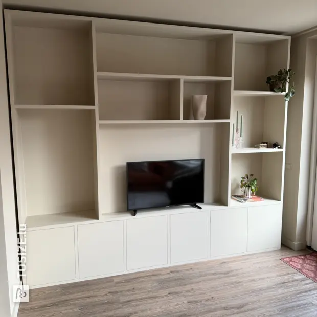 Cream cupboard wall with open compartments and doors
