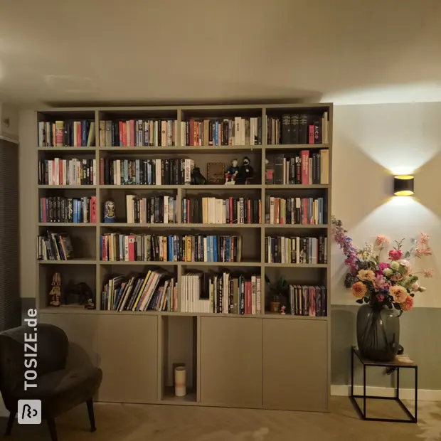 Gray bookcase with doors and open compartments