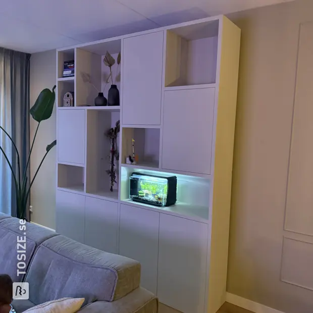 White cupboard wall with doors and open compartments