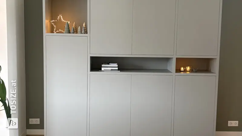 Custom-made living room cupboard with plenty of storage space, by Marlou