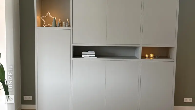 Custom-made living room cupboard with plenty of storage space, by Marlou