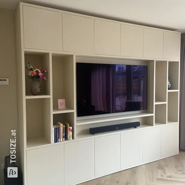 Cream cupboard wall with open compartments and doors