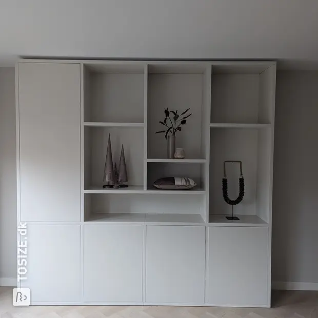 White cabinet with doors and open compartments