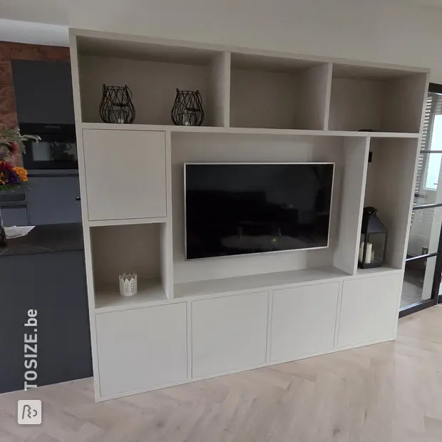 White cupboard wall with open compartments and doors