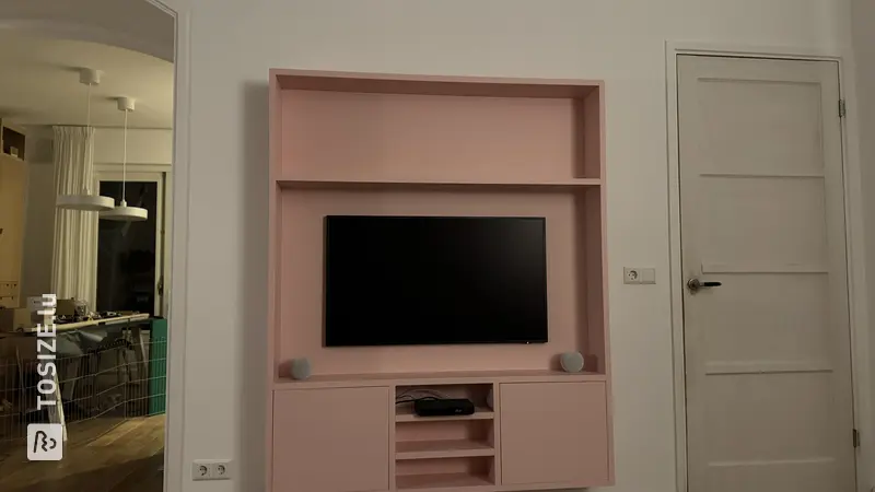 Pink TV cabinet in the living room, by Tom
