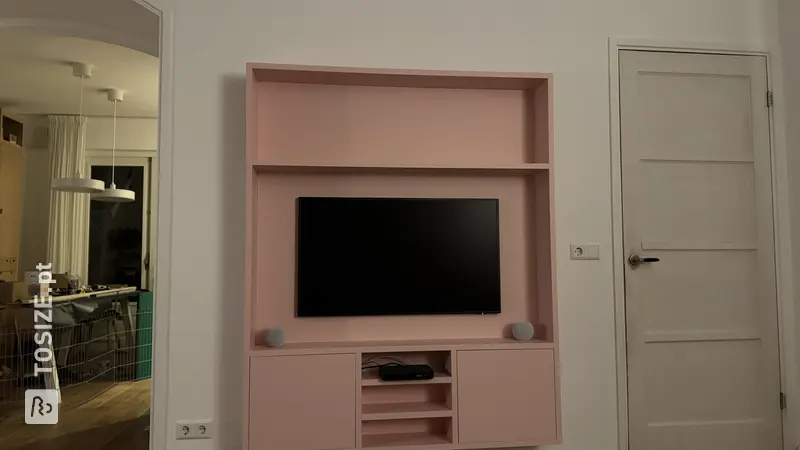Pink TV cabinet in the living room, by Tom