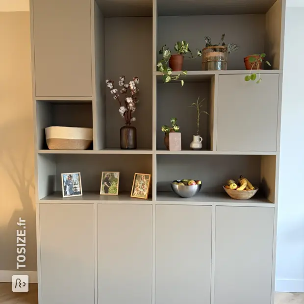 Gray cupboard wall with doors and open compartments