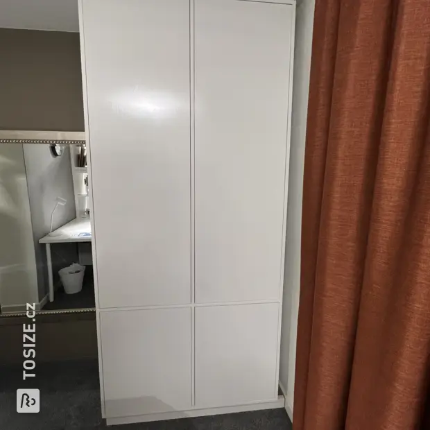 White cabinet with doors and open compartments
