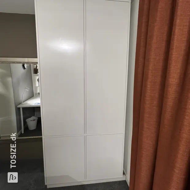 White cabinet with doors and open compartments