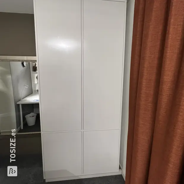 White cabinet with doors and open compartments