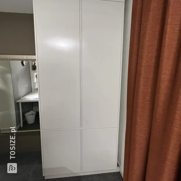 White cabinet with doors and open compartments