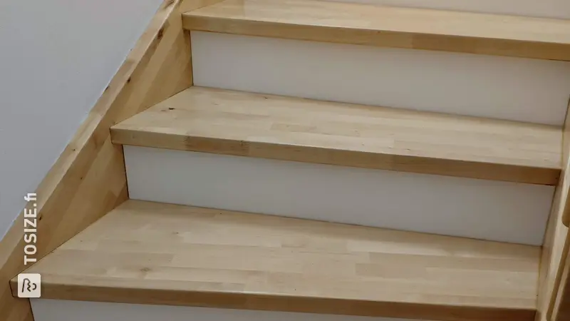 Closing an open staircase with poplar wood, door Nikolai
