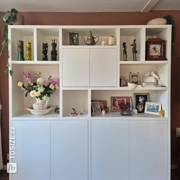 White cupboard wall with open compartments and doors
