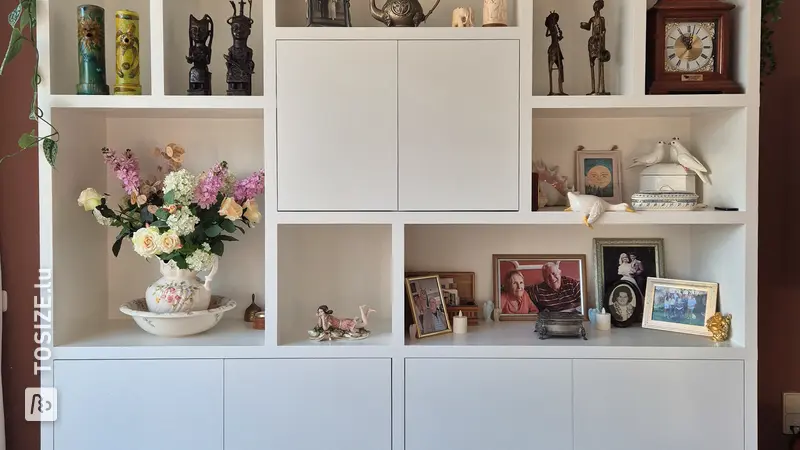 Custom white bookcase with glass display, by Kelsey