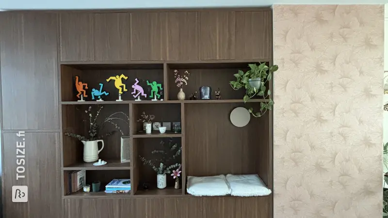 Stylish cupboard wall with seating area and TV cabinet in walnut wood, by Anouk