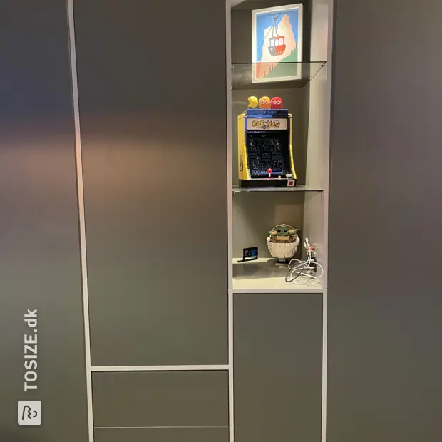 Gray cabinet with doors and open compartments