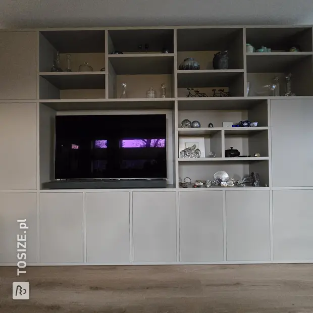 Cream cupboard wall with open compartments and doors