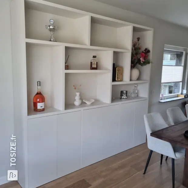 White cupboard wall with open compartments and doors