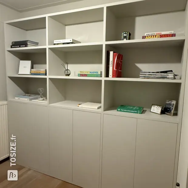 Gray cabinet with doors and open compartments