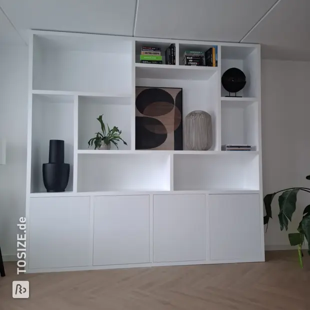 White shelving unit with open compartments and doors