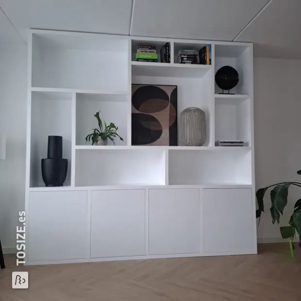 White shelving unit with open compartments and doors