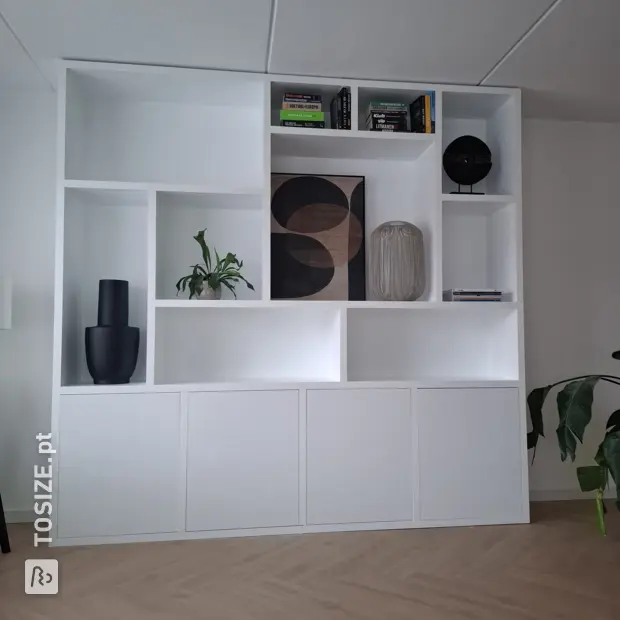 White shelving unit with open compartments and doors