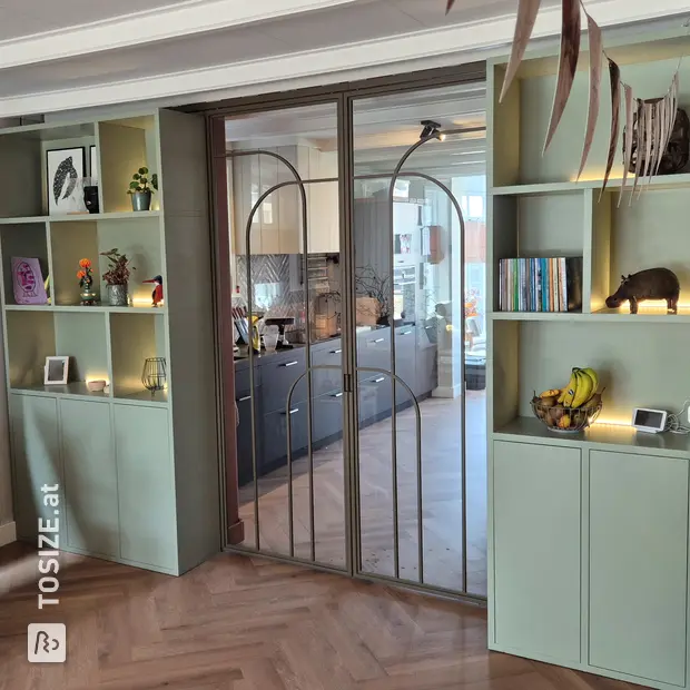 Green wall unit with doors and open compartments