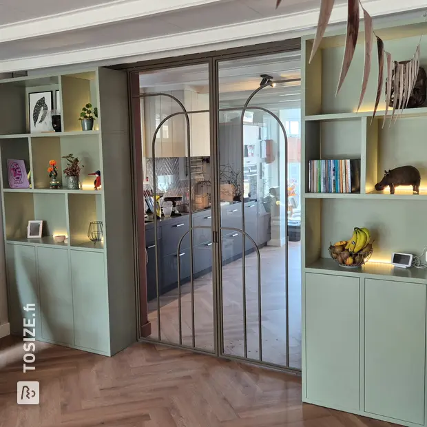 Green wall unit with doors and open compartments
