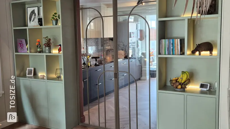 Stylish ensuite wardrobe with sliding doors and light bar, by Chris