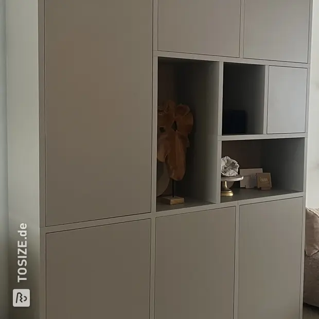 Gray cabinet with open compartments and doors