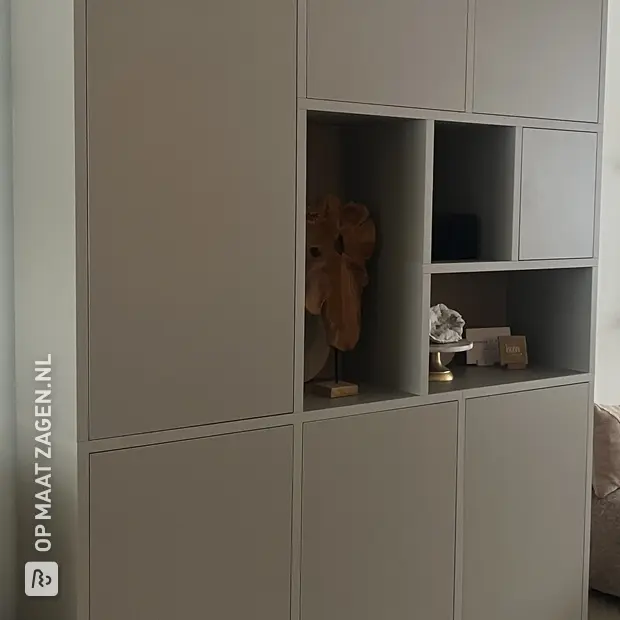 Gray cabinet with open compartments and doors