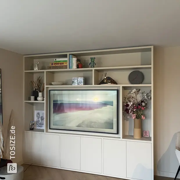 White cupboard wall with open compartments and doors