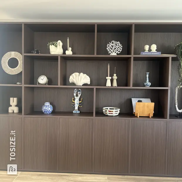 Dark wall unit with doors and open compartments