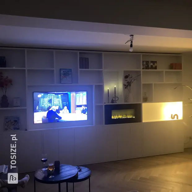 White cupboard wall with open compartments and doors