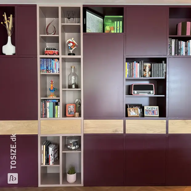 Purple cabinet with open compartments and doors