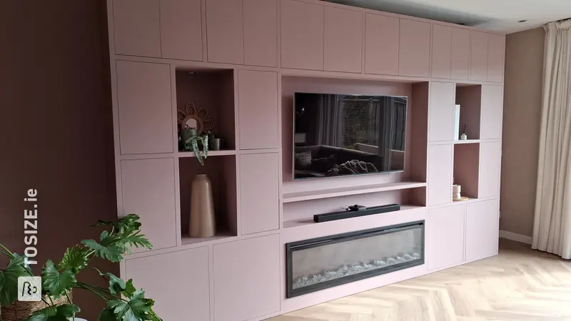 Large TV cabinet with cinewall and fireplace, by Nynke