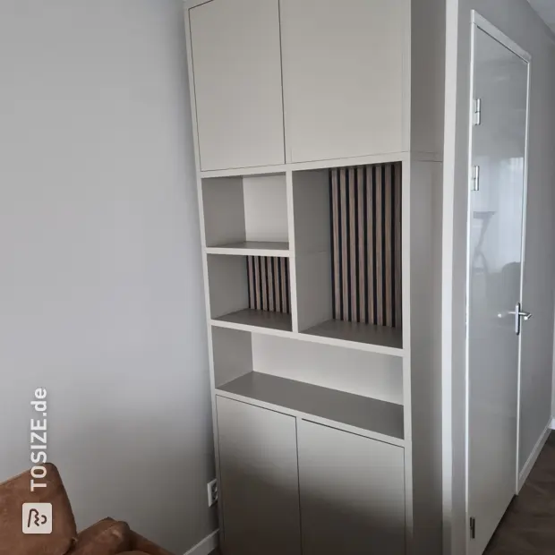 Cream cabinet with doors and open compartments