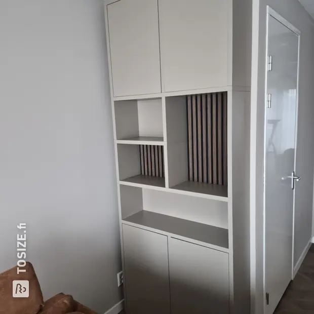 Cream cabinet with doors and open compartments
