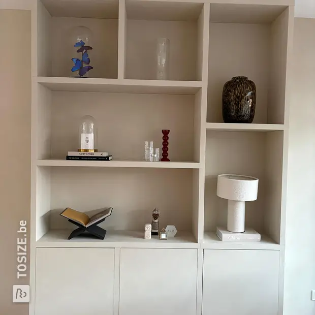 Cream cupboard wall with open compartments and doors