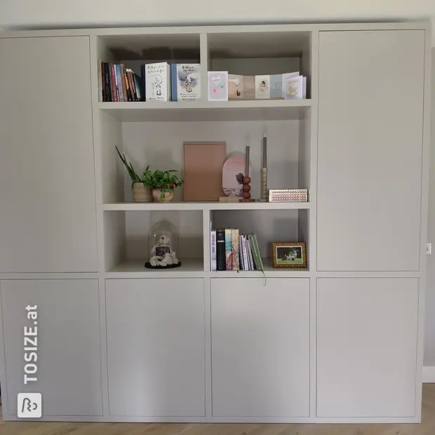 Light cabinet wall with doors and open compartments