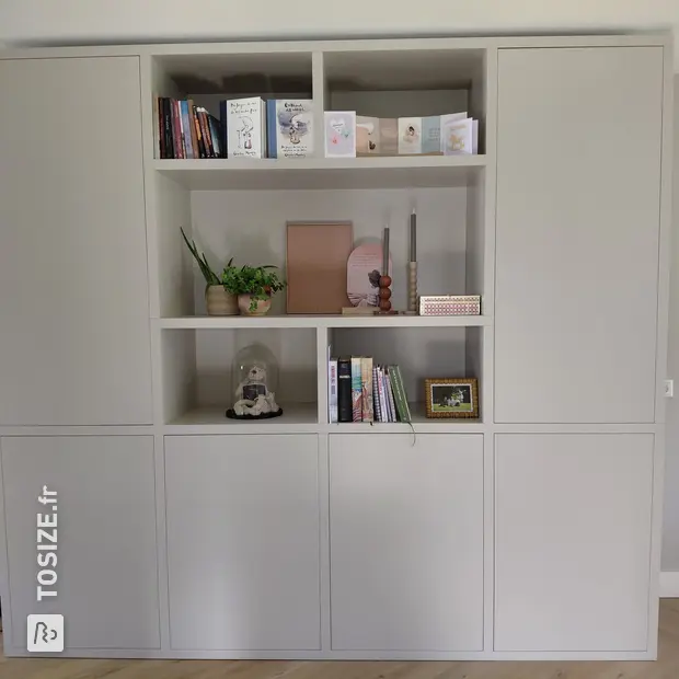 Light cabinet wall with doors and open compartments