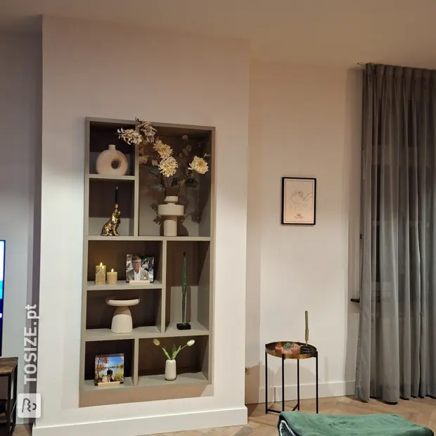 Beige display cabinet with open compartments and shelves