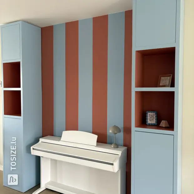 Blue wall unit with open compartments and doors