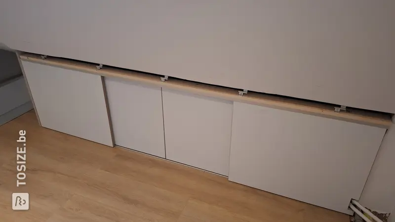 Maximum Storage Space with Sliding Doors in the Attic, by Youri
