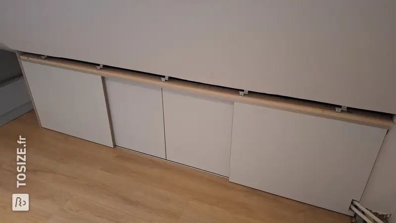 Maximum Storage Space with Sliding Doors in the Attic, by Youri