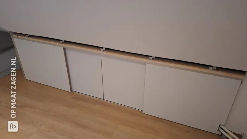 Maximum Storage Space with Sliding Doors in the Attic, by Youri