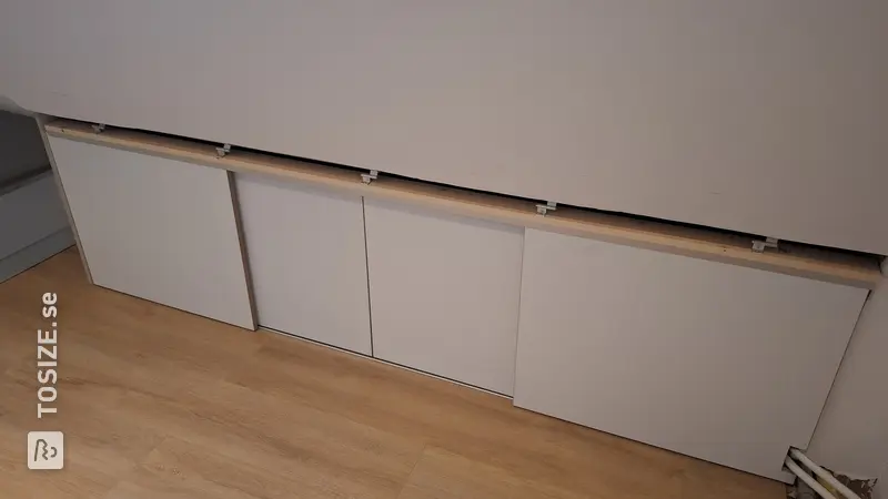 Maximum Storage Space with Sliding Doors in the Attic, by Youri